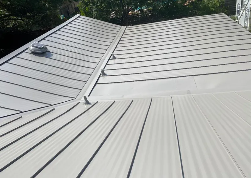 Solar attic fan installed on a metal roof for Roof Ventilation in Old Saybrook